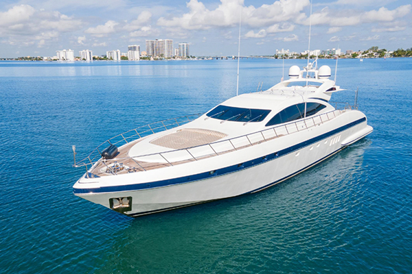 Snorkeling near vibrant coral reefs during a Bahamas yacht charter.
